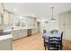 Spacious kitchen features stainless steel appliances, light cabinetry, and a dining area at 3784 Robinson Ne Rd, Marietta, GA 30068