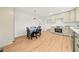 Spacious kitchen leading to a dining area with stainless steel appliances and light-colored cabinets at 3784 Robinson Ne Rd, Marietta, GA 30068