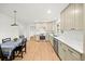 Bright, open kitchen and dining area with stainless steel appliances and light-colored cabinetry at 3784 Robinson Ne Rd, Marietta, GA 30068