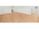 Spacious living space with wood floor, white walls, and modern trim with bright light at 3784 Robinson Ne Rd, Marietta, GA 30068