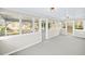 Spacious sunroom features multiple windows and doors that lead to the backyard at 3784 Robinson Ne Rd, Marietta, GA 30068