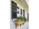 Close up of a window box with black shutters. Great curb appeal and outdoor charm! at 3784 Robinson Ne Rd, Marietta, GA 30068