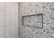 Walk-in shower with decorative tile and a built-in niche at 482 Majestic Oaks Pl, Smyrna, GA 30082