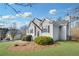 Charming gray home featuring manicured lawn, tasteful stone accents, and well-maintained landscaping at 108 Sweetbriar Ct, Canton, GA 30115