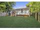 Spacious backyard with a well-maintained lawn and a wooden fence at 1705 Evans, Atlanta, GA 30310