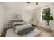 Cozy bedroom with neutral tones, modern furniture, and a large window for natural light at 1705 Evans, Atlanta, GA 30310