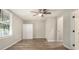 Bright bedroom featuring hardwood floors, a ceiling fan and ample closet space at 1705 Evans, Atlanta, GA 30310