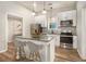 Stylish kitchen featuring white cabinets, stainless steel appliances, and a granite-topped island at 1705 Evans, Atlanta, GA 30310