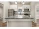 Charming kitchen featuring granite countertops, stainless steel appliances, an island and updated fixtures at 1705 Evans, Atlanta, GA 30310