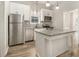 Charming kitchen featuring granite countertops, stainless steel appliances, an island and updated fixtures at 1705 Evans, Atlanta, GA 30310