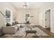 Bright living room with a comfortable sectional sofa, modern decor, and ample natural light at 1705 Evans, Atlanta, GA 30310
