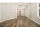 Open-concept living area with stylish flooring and multiple doorways leading to other rooms at 1705 Evans, Atlanta, GA 30310