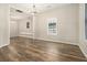 Open-concept living area with stylish flooring and multiple doorways leading to other rooms at 1705 Evans, Atlanta, GA 30310