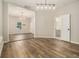 Bright living room featuring modern lighting and hardwood floors with access to the bathroom and additional room at 1705 Evans, Atlanta, GA 30310