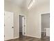 Bright living room featuring modern lighting and hardwood floors with access to another room at 1705 Evans, Atlanta, GA 30310