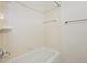 Tiled shower and bathtub with white fixtures and a showerhead at 4254 River Green Nw Dr # 611, Atlanta, GA 30327