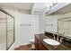 Bright bathroom featuring granite countertops, a glass-enclosed shower, and chrome fixtures at 4254 River Green Nw Dr # 611, Atlanta, GA 30327
