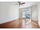 Bedroom with hardwood floors, neutral walls, closet, and balcony access for natural light at 4254 River Green Nw Dr # 611, Atlanta, GA 30327