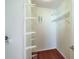 Walk-in closet with hardwood floors and multiple shelves for organizing at 4254 River Green Nw Dr # 611, Atlanta, GA 30327