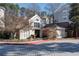 A clubhouse with an arched window is surrounded by mature trees and landscaping at 4254 River Green Nw Dr # 611, Atlanta, GA 30327