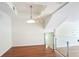 Dining area showcasing hardwood floors, glass railings, and contemporary lighting at 4254 River Green Nw Dr # 611, Atlanta, GA 30327