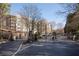Gated community entrance with mature trees surrounding the residential buildings at 4254 River Green Nw Dr # 611, Atlanta, GA 30327