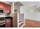 Open floor plan between the kitchen and living room features hardwood floors and natural light at 4254 River Green Nw Dr # 611, Atlanta, GA 30327