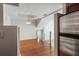 Spacious living room features hardwood floors, natural light, glass railing, and a modern light fixture at 4254 River Green Nw Dr # 611, Atlanta, GA 30327