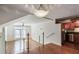Lofted living area with hardwood floors, glass railings, modern lighting, and open floor plan at 4254 River Green Nw Dr # 611, Atlanta, GA 30327