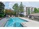Refreshing community pool with ample seating and clear blue water, ideal for summer enjoyment at 4254 River Green Nw Dr # 611, Atlanta, GA 30327