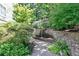 Landscaped walking path featuring a charming stone waterfall and lush greenery at 4254 River Green Nw Dr # 611, Atlanta, GA 30327