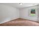 Cozy bedroom with neutral carpet and a window at 555 Brickleberry Ln, Roswell, GA 30075