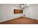 Bonus room area with carpet, closet, built in cabinets, and a ceiling fan at 555 Brickleberry Ln, Roswell, GA 30075