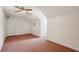 Spacious bonus room with carpet, neutral walls, ceiling fan, and plenty of natural light at 555 Brickleberry Ln, Roswell, GA 30075