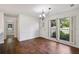 Dining room featuring hardwood floors, large windows, and modern lighting at 555 Brickleberry Ln, Roswell, GA 30075