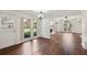 Spacious living room with hardwood floors, large windows, and decorative molding at 555 Brickleberry Ln, Roswell, GA 30075