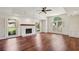 Bright living room with hardwood floors, a fireplace and large windows at 555 Brickleberry Ln, Roswell, GA 30075