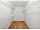 Organized walk-in closet with ample shelving for storage at 555 Brickleberry Ln, Roswell, GA 30075