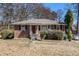 Charming brick home with a cozy front porch and well-maintained landscaping at 1210 Stoneybrook Rd, Forest Park, GA 30297