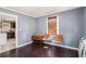 Additional living room area adjacent to the kitchen with wood flooring and lots of light at 1210 Stoneybrook Rd, Forest Park, GA 30297