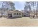 View of the home's back exterior featuring a sunroom with a fenced yard at 2222 Ivy Crest Dr, Buford, GA 30519