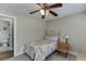 Cozy bedroom with a ceiling fan and attached bathroom for added convenience at 2222 Ivy Crest Dr, Buford, GA 30519