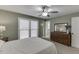 Bedroom features a large window, dresser, and a partial view into the en-suite bathroom at 2222 Ivy Crest Dr, Buford, GA 30519