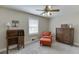 Bright bedroom with a desk, chair, dresser, and natural light from the window at 2222 Ivy Crest Dr, Buford, GA 30519