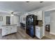 Kitchen featuring an island, granite countertops, and black refrigerator at 2222 Ivy Crest Dr, Buford, GA 30519