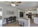 Modern kitchen with granite countertops, white cabinets, and black appliances with adjacent breakfast area at 2222 Ivy Crest Dr, Buford, GA 30519