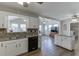 Open-concept kitchen with granite countertops and view into the sunroom at 2222 Ivy Crest Dr, Buford, GA 30519