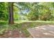 Expansive backyard with mature trees and lush green space offers privacy and serenity at 4110 Ridgebrook Bnd, Cumming, GA 30028