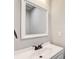 Clean bathroom with a modern sink, white vanity, and a well-lit mirror at 4110 Ridgebrook Bnd, Cumming, GA 30028