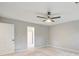 Bedroom with a neutral carpet, ceiling fan and a door leading to the bathroom at 4110 Ridgebrook Bnd, Cumming, GA 30028